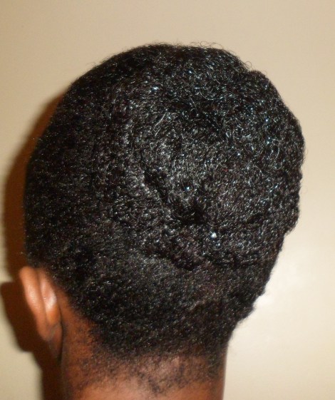 I achieved this Clustered Bun by tying my hair in a puff and pin curling it.