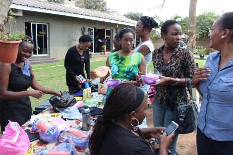 There were many items on sale including hair products, accessories, and styling tools such as heating caps, satin bonnets, spray bottles, mixing bowls etc