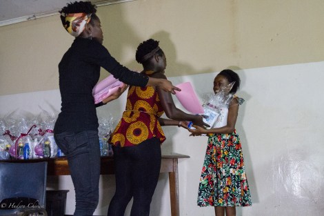 Handing out the information folder and starter packs to the winning students