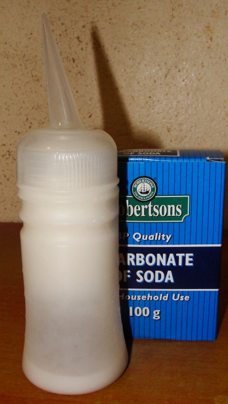 I use an applicator bottle to apply the baking soda/bicarbonate of soda rinse to my hair. 